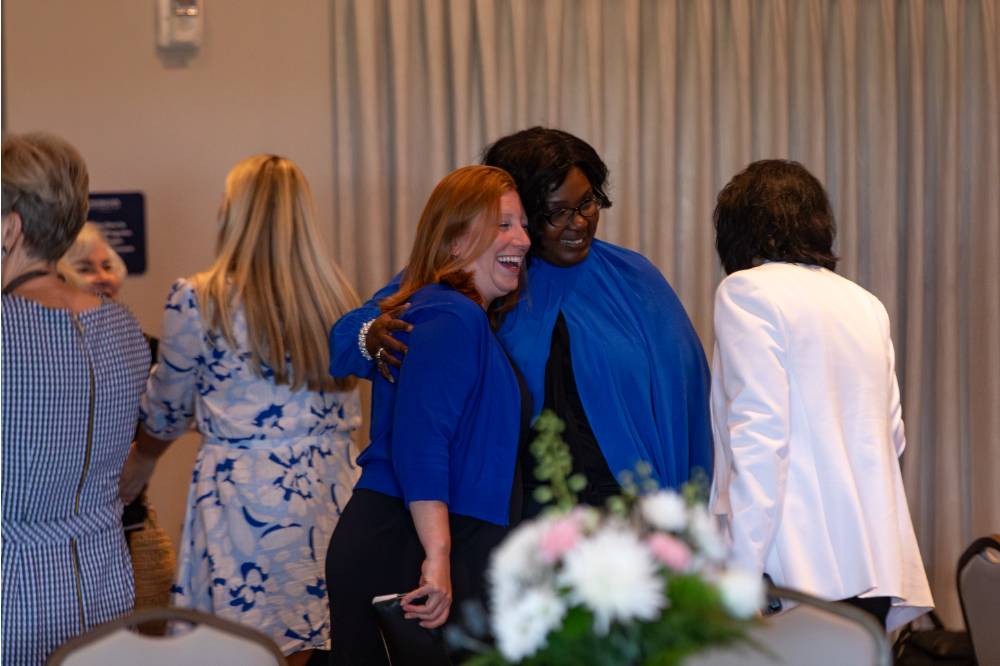 President Mantella talking wtih two reception guests